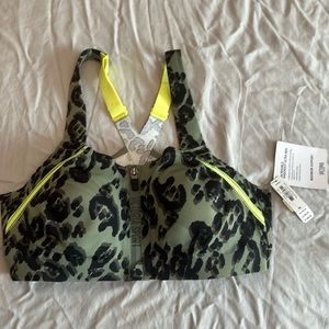 Adorable, neon Victoria’s Secret sports bra, 36C front zip